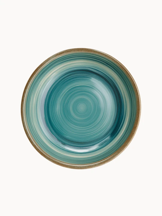 A top-down view of a round ceramic plate featuring a glossy teal and turquoise glaze with concentric swirl patterns and a brown rim.